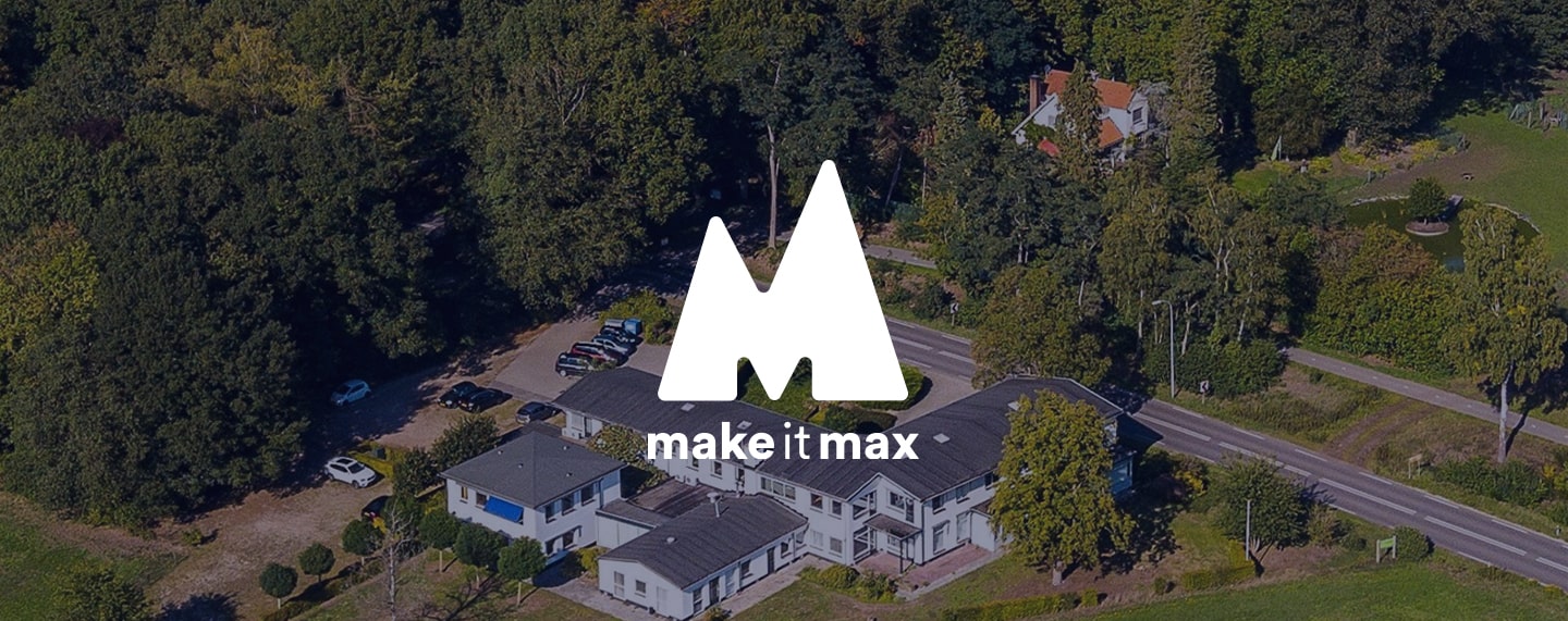 Drone shot of Make it Max office with logo on dark transparant background